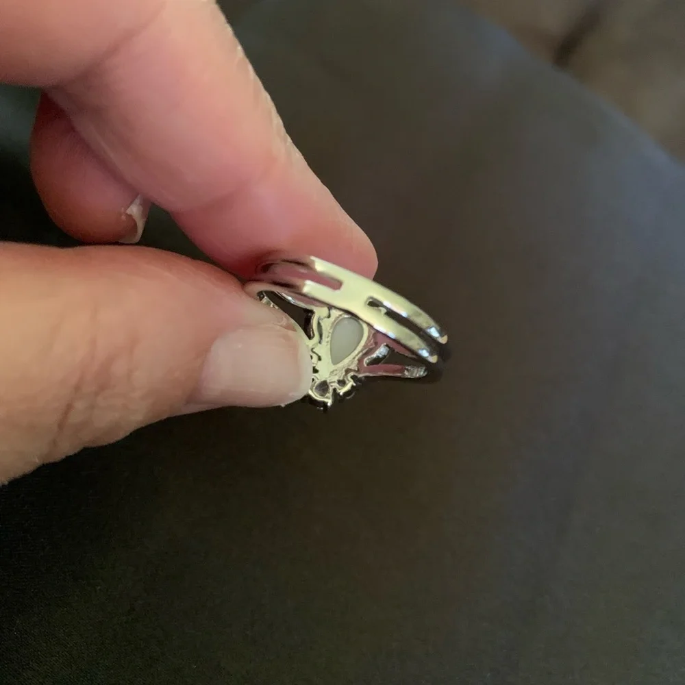 Silver tone teardrop shape faux pearl ring with crystals
